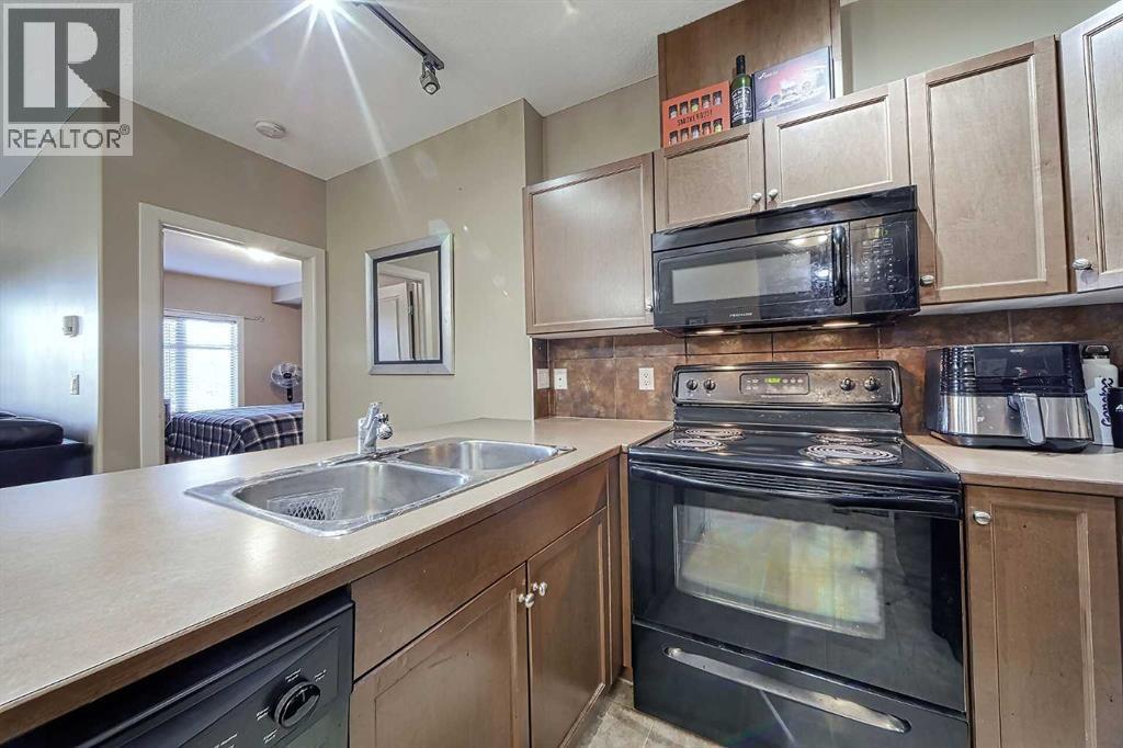 242, 52 Cranfield Link Se, Calgary, AB - Indoor Photo Showing Kitchen With Double Sink