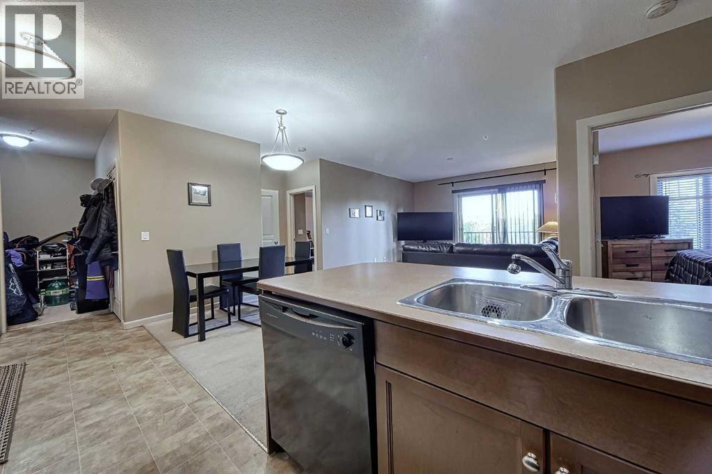 242, 52 Cranfield Link Se, Calgary, AB - Indoor Photo Showing Kitchen With Double Sink