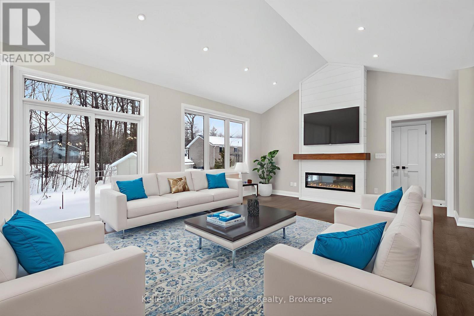 Digitally Staged - 62 Rue Vanier, Tiny, ON - Indoor Photo Showing Living Room With Fireplace