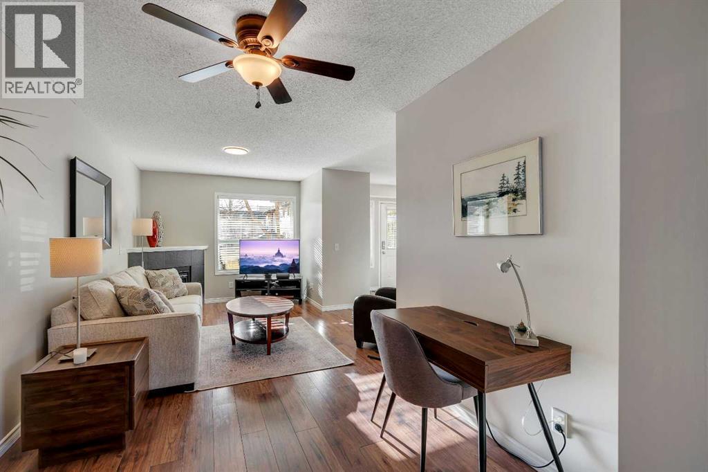 86 Eversyde Common Sw, Calgary, AB - Indoor Photo Showing Living Room
