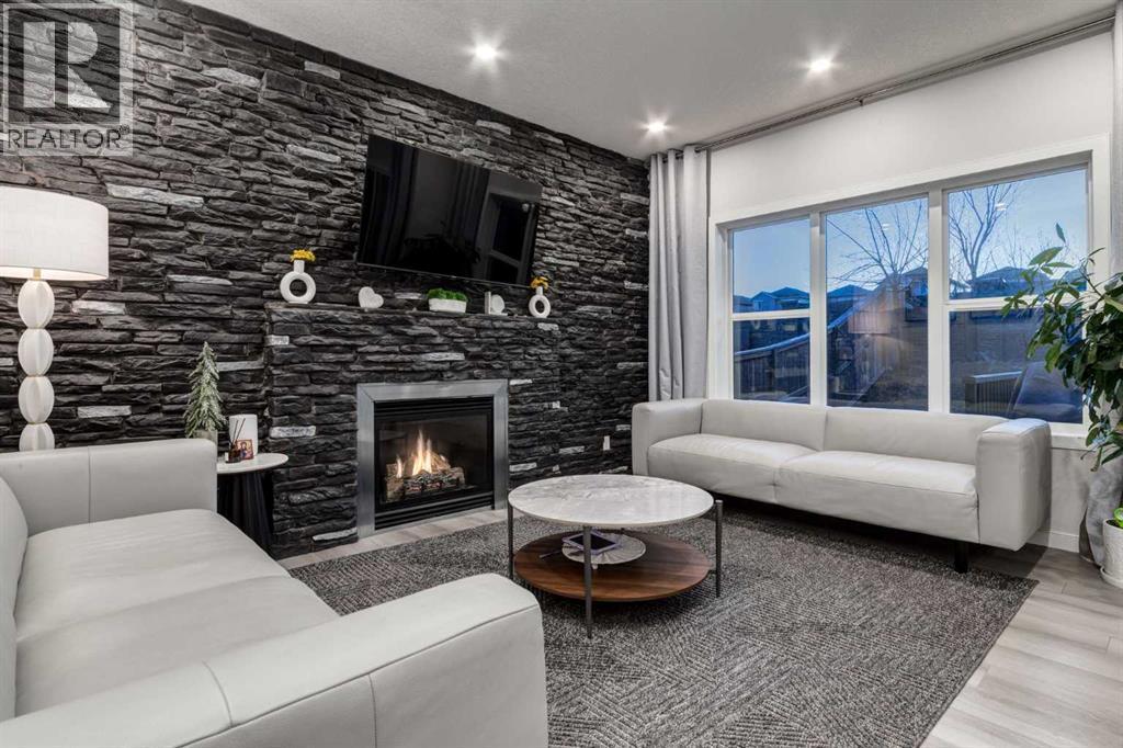 110 Sage Bank Grove Nw, Calgary, AB - Indoor Photo Showing Living Room With Fireplace