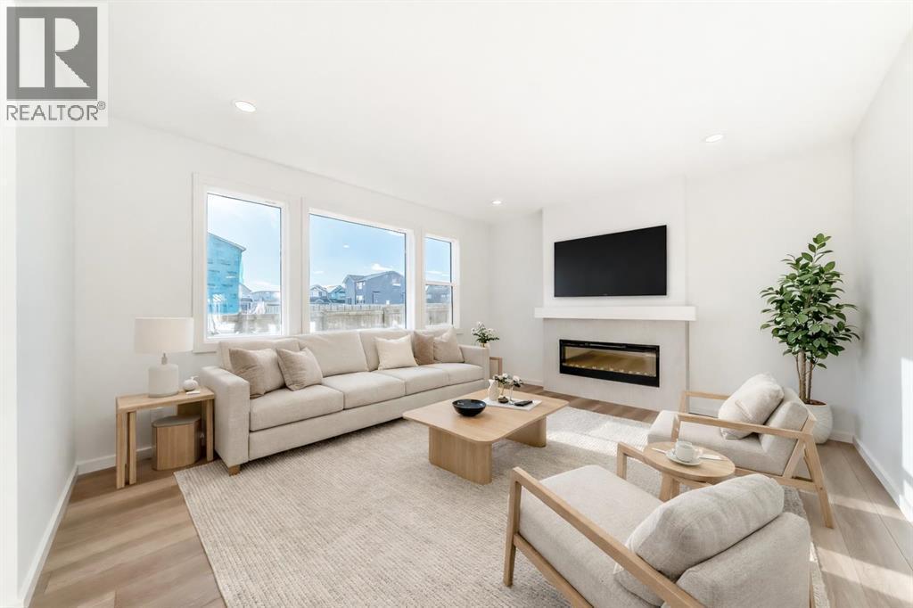 VIRTUALLY STAGED - 63 Creekside Path Sw, Calgary, AB - Indoor Photo Showing Living Room With Fireplace