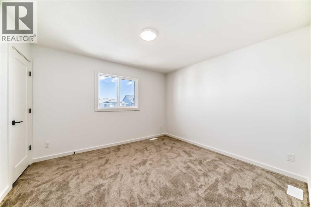 63 Creekside Path Sw, Calgary, AB - Indoor Photo Showing Other Room