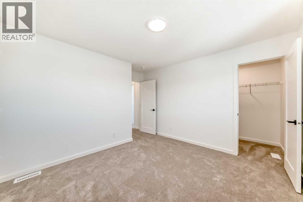 63 Creekside Path Sw, Calgary, AB - Indoor Photo Showing Other Room