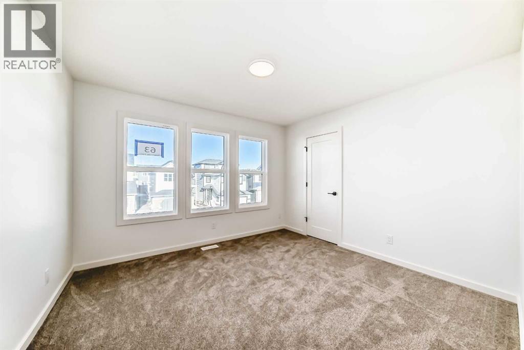 63 Creekside Path Sw, Calgary, AB - Indoor Photo Showing Other Room