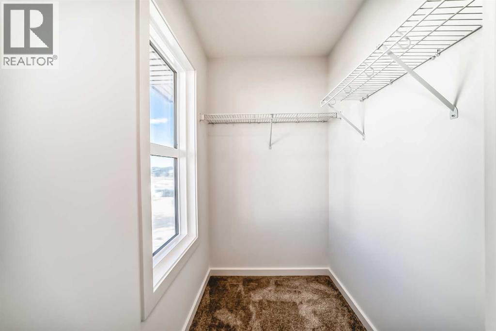 63 Creekside Path Sw, Calgary, AB - Indoor With Storage