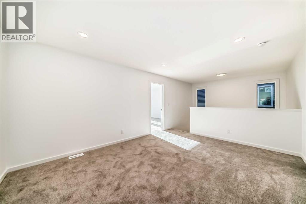 63 Creekside Path Sw, Calgary, AB - Indoor Photo Showing Other Room