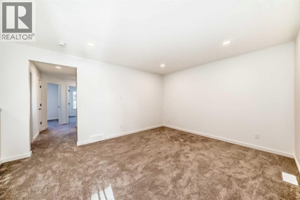 63 Creekside Path Sw, Calgary, AB - Indoor Photo Showing Other Room