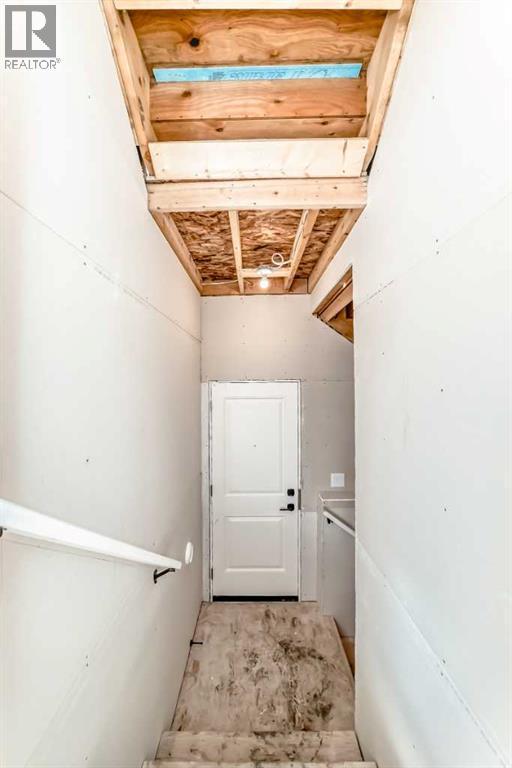63 Creekside Path Sw, Calgary, AB - Indoor Photo Showing Other Room