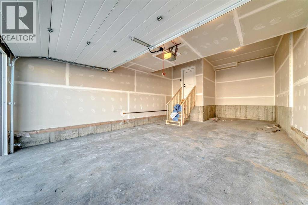 63 Creekside Path Sw, Calgary, AB - Indoor Photo Showing Garage