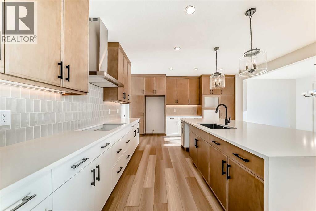 PLEASE NOTE: Kitchen appliances are included, and will be installed prior to possession - 63 Creekside Path Sw, Calgary, AB - Indoor Photo Showing Kitchen With Upgraded Kitchen