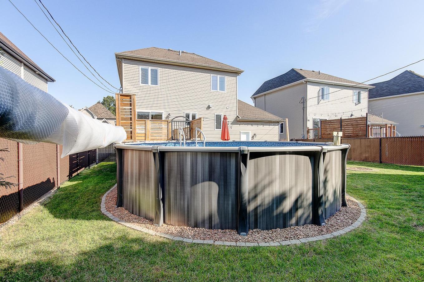 Pool - 51 Rue Ravel, Saint-Jean-Sur-Richelieu, QC - Outdoor With Above Ground Pool With Exterior