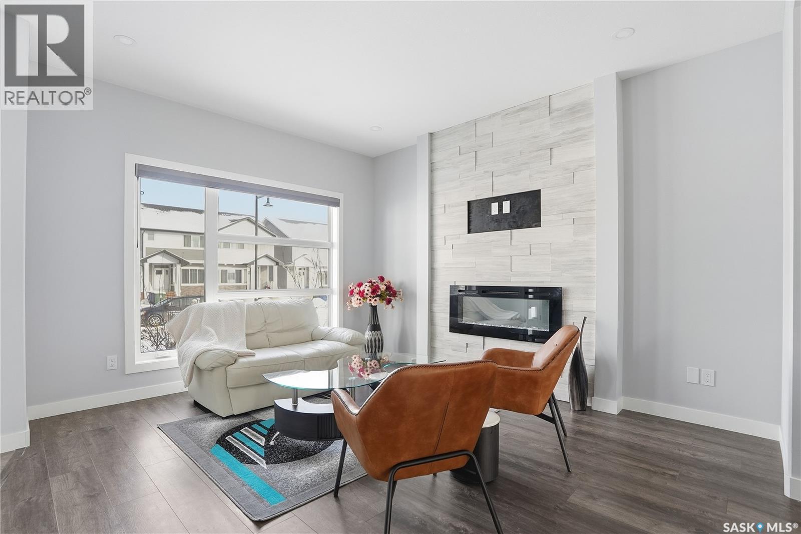 306 Brighton Boulevard, Saskatoon, SK - Indoor Photo Showing Living Room With Fireplace