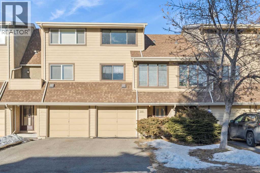 308 Woodvale Crescent Sw, Calgary, AB - Outdoor With Facade