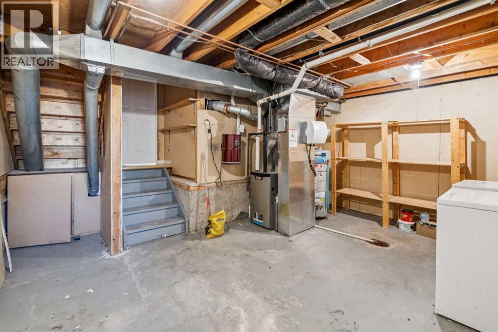 308 Woodvale Crescent Sw, Calgary, AB - Indoor Photo Showing Basement