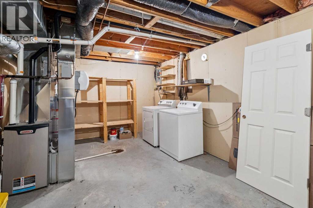 308 Woodvale Crescent Sw, Calgary, AB - Indoor Photo Showing Laundry Room