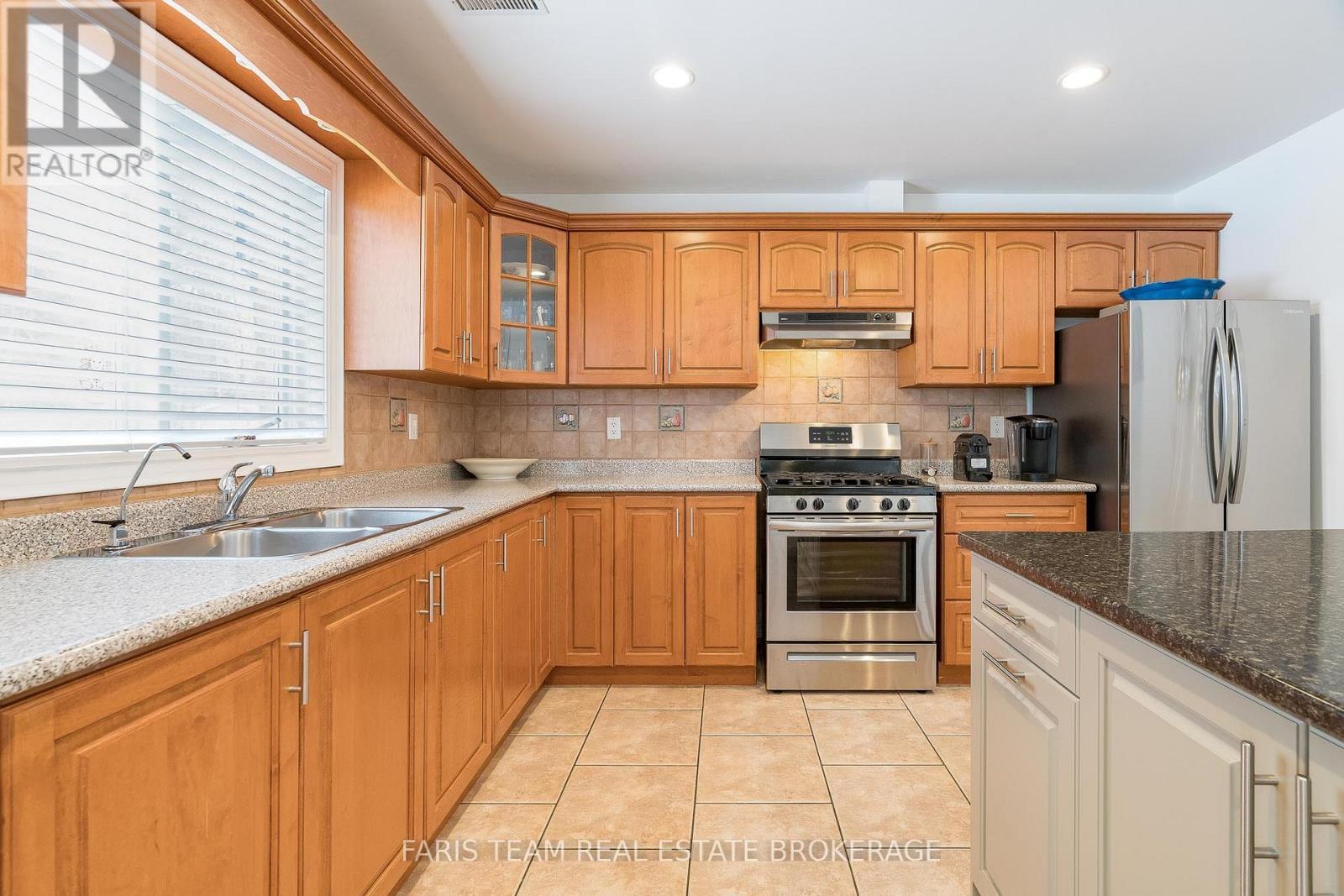 100 Desroches Trail, Tiny, ON - Indoor Photo Showing Kitchen With Double Sink