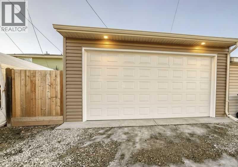 Your BRAND new (2025) oversized double car garage: 20 x 24. Oversized door, tall ceilings and upgraded electrical - 7840 20A Street Se, Calgary, AB - Outdoor With Exterior