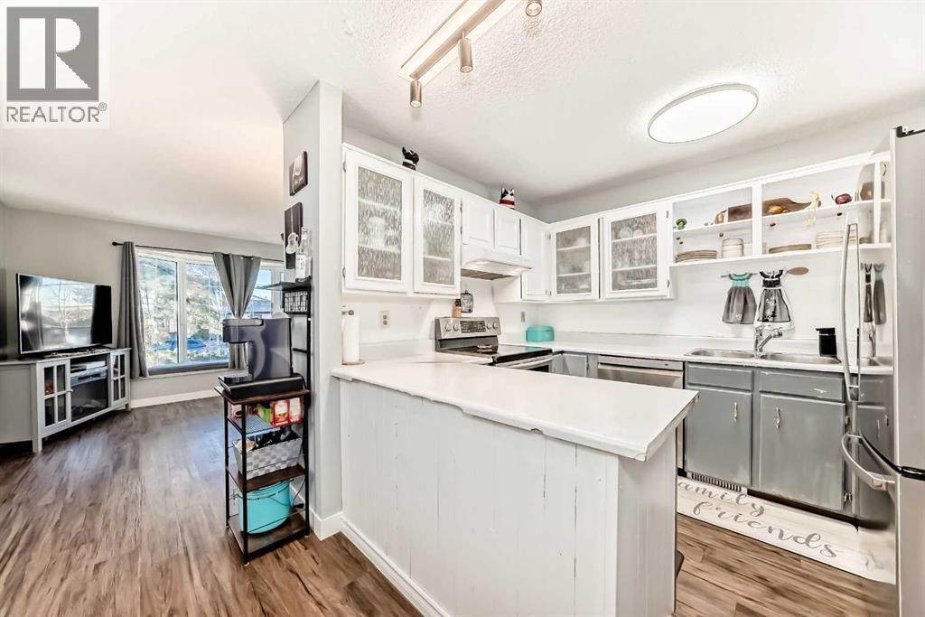 Your kitchen featuring new appliances (with transferable extended warranty) - 7840 20A Street Se, Calgary, AB - Indoor Photo Showing Kitchen With Double Sink