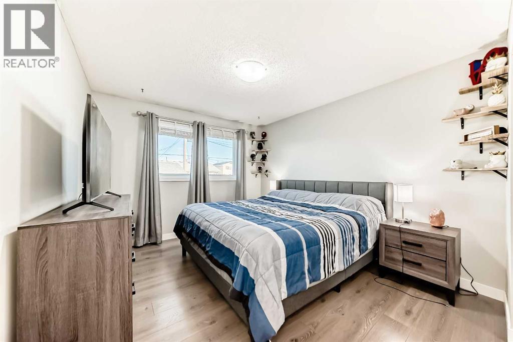 Your MASSIVE Primary bedroom, that easily holds a King size bed and more! - 7840 20A Street Se, Calgary, AB - Indoor Photo Showing Bedroom