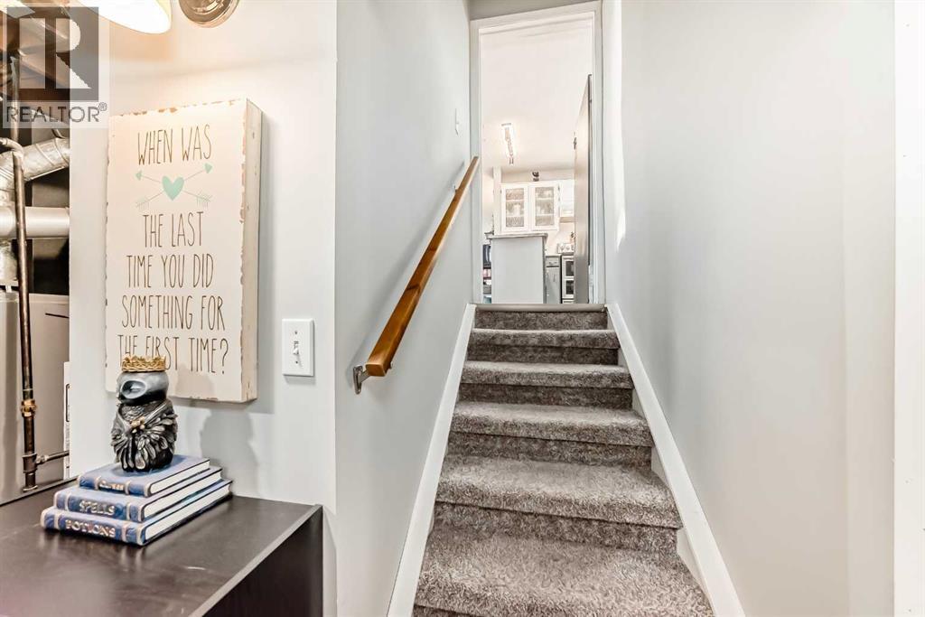 Stairs leading downstairs - 7840 20A Street Se, Calgary, AB - Indoor Photo Showing Other Room