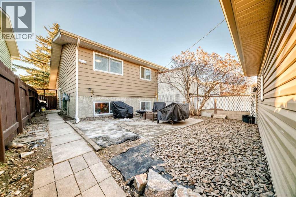 New stone, rock and patio space will be an amazing space to enjoy our upcoming warmer months - 7840 20A Street Se, Calgary, AB - Outdoor With Exterior