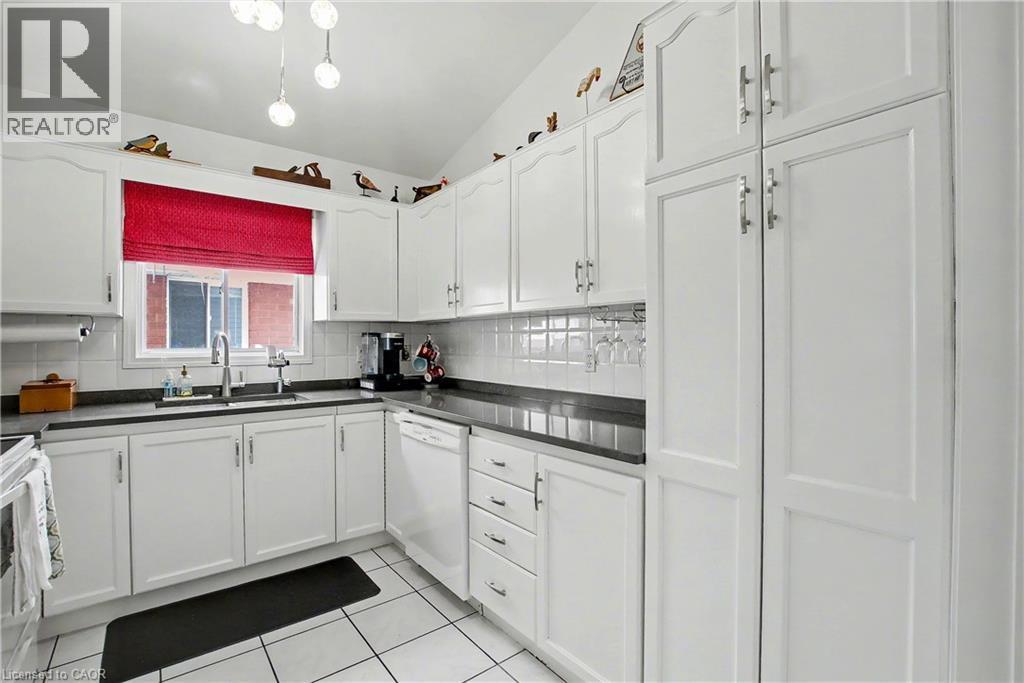 lots of storage in the kitchen - 252 Keewatin Avenue, Kitchener, ON - Indoor Photo Showing Kitchen With Double Sink