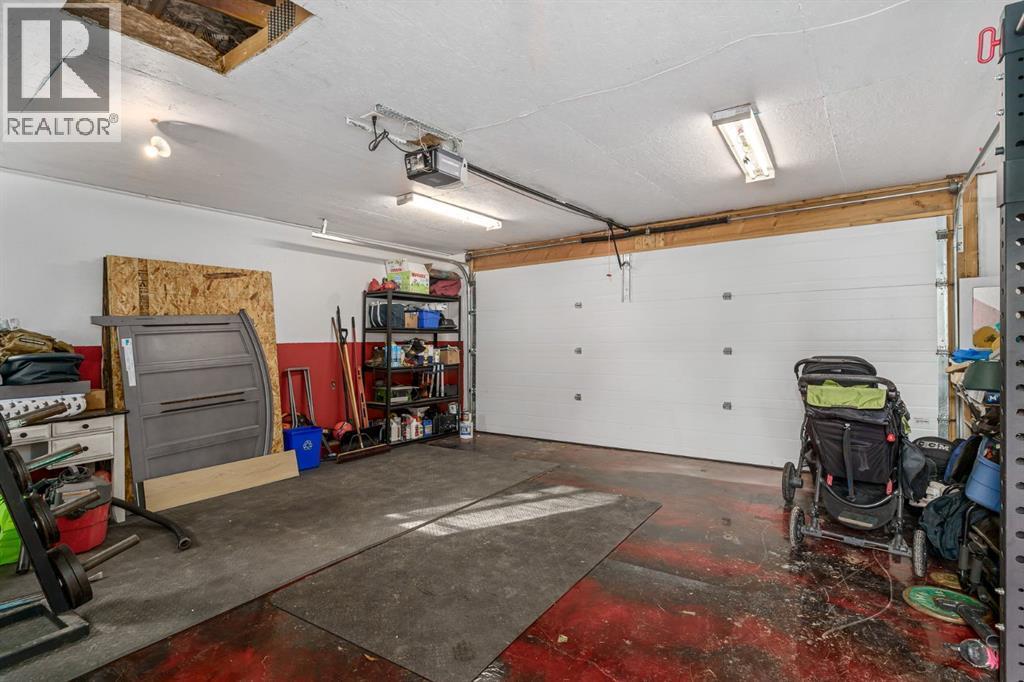 17 Aster Place Se, Airdrie, AB - Indoor Photo Showing Garage