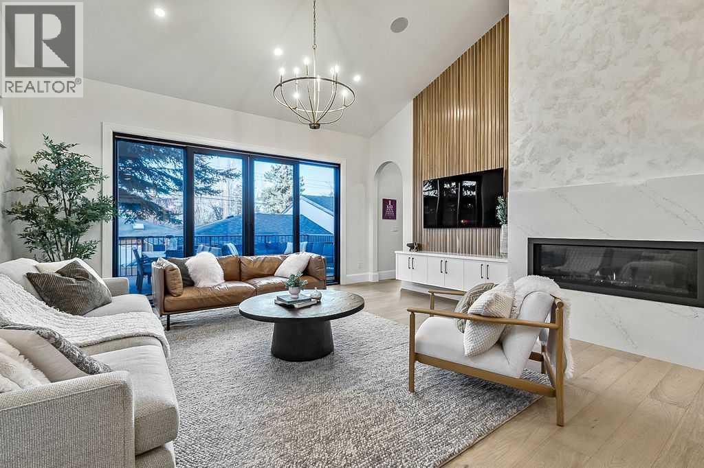 56 Lissington Drive Sw, Calgary, AB - Indoor Photo Showing Living Room With Fireplace