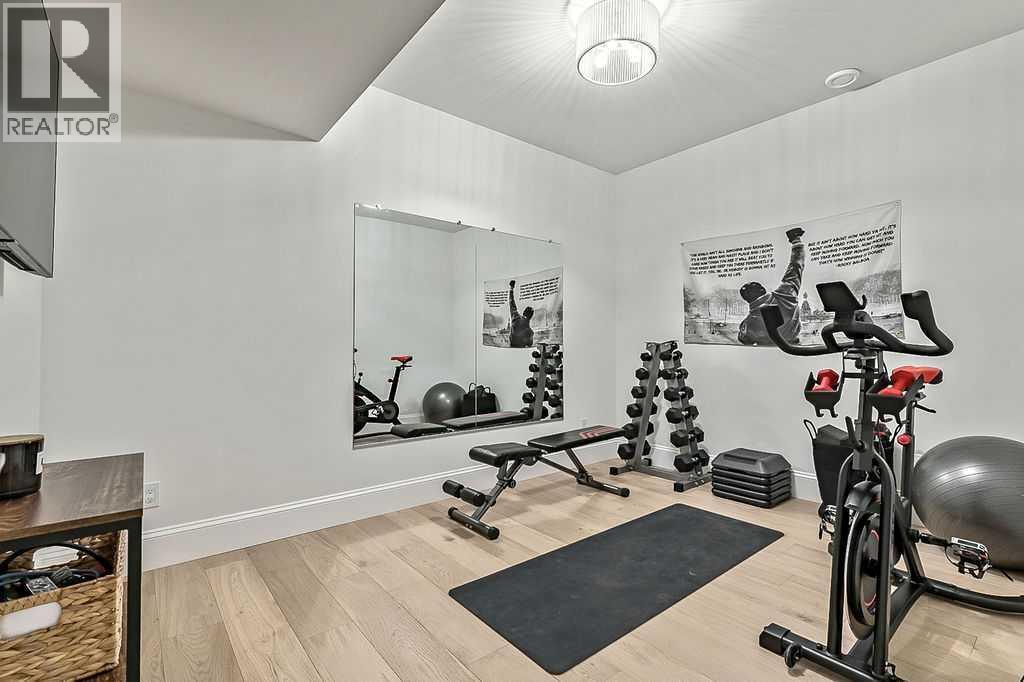 56 Lissington Drive Sw, Calgary, AB - Indoor Photo Showing Gym Room