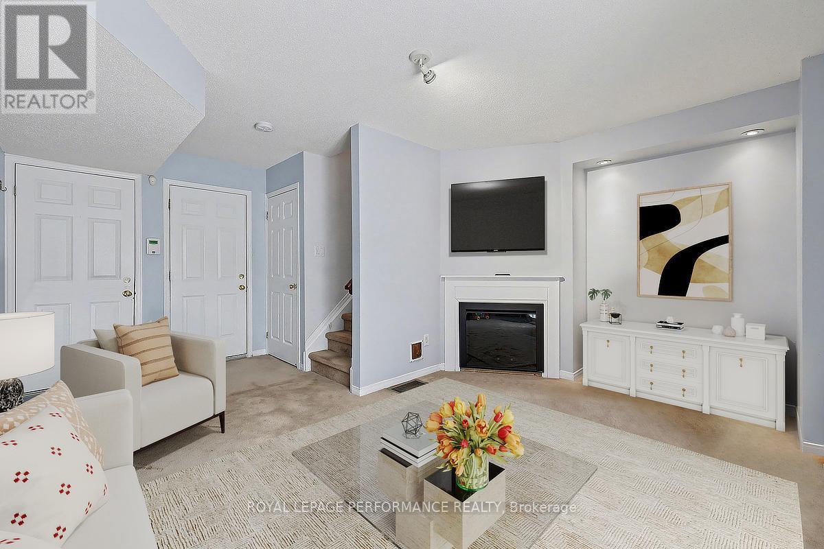 83 Manhattan Crescent, Ottawa, ON - Indoor Photo Showing Living Room With Fireplace