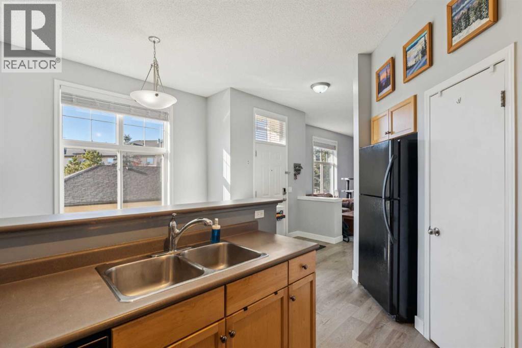 77 Mckenzie Towne Gate Se, Calgary, AB - Indoor Photo Showing Kitchen With Double Sink