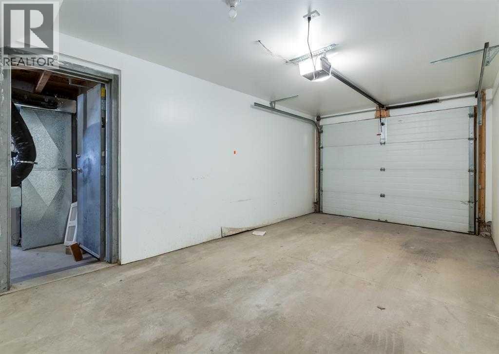 77 Mckenzie Towne Gate Se, Calgary, AB - Indoor Photo Showing Garage
