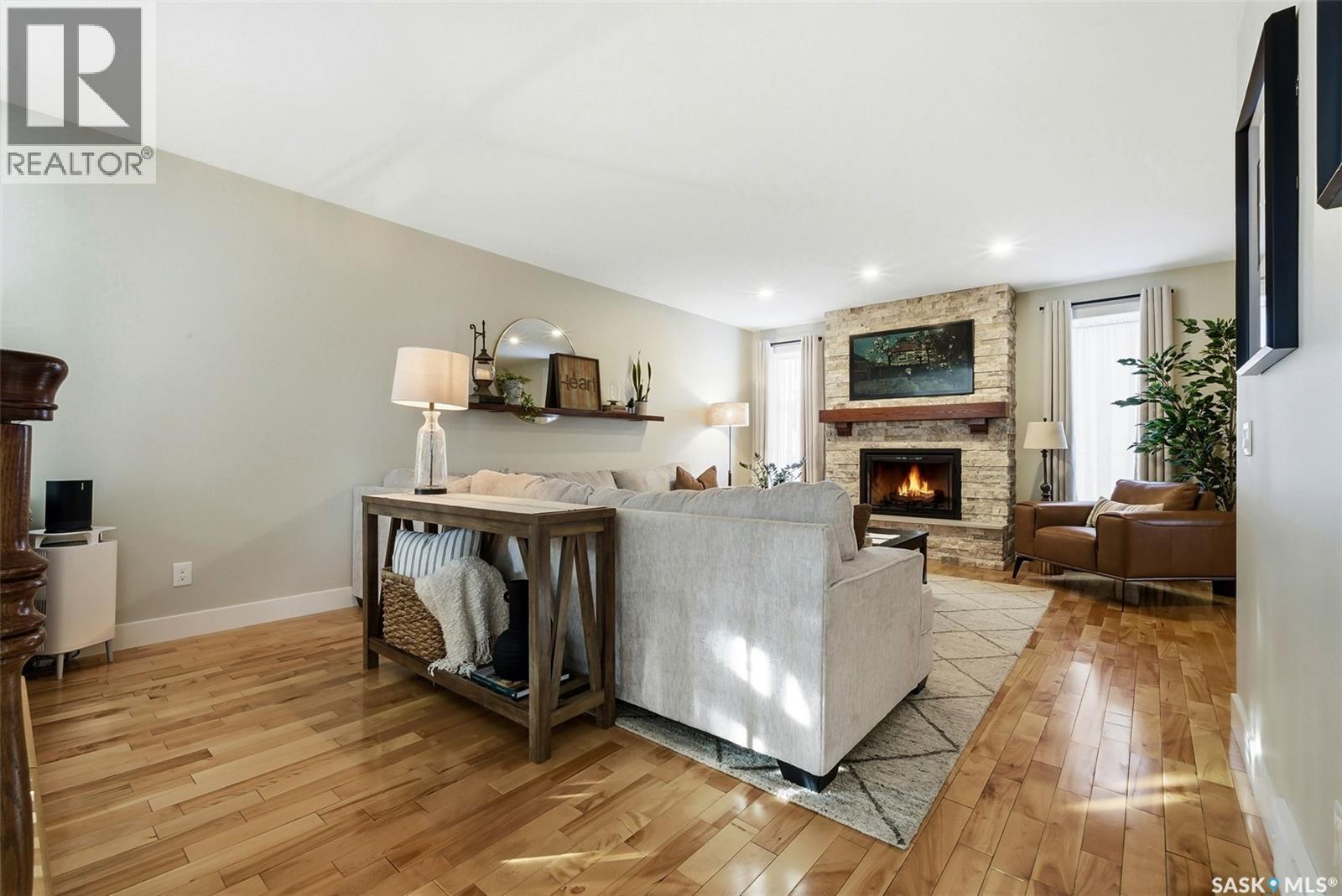 2611 Grainger Place E, Regina, SK - Indoor Photo Showing Living Room With Fireplace