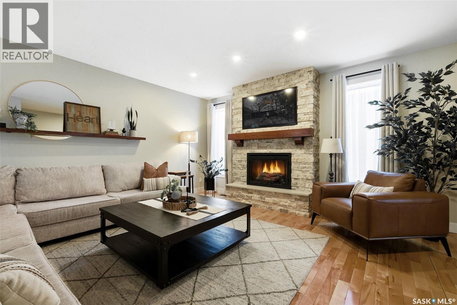 2611 Grainger Place E, Regina, SK - Indoor Photo Showing Living Room With Fireplace