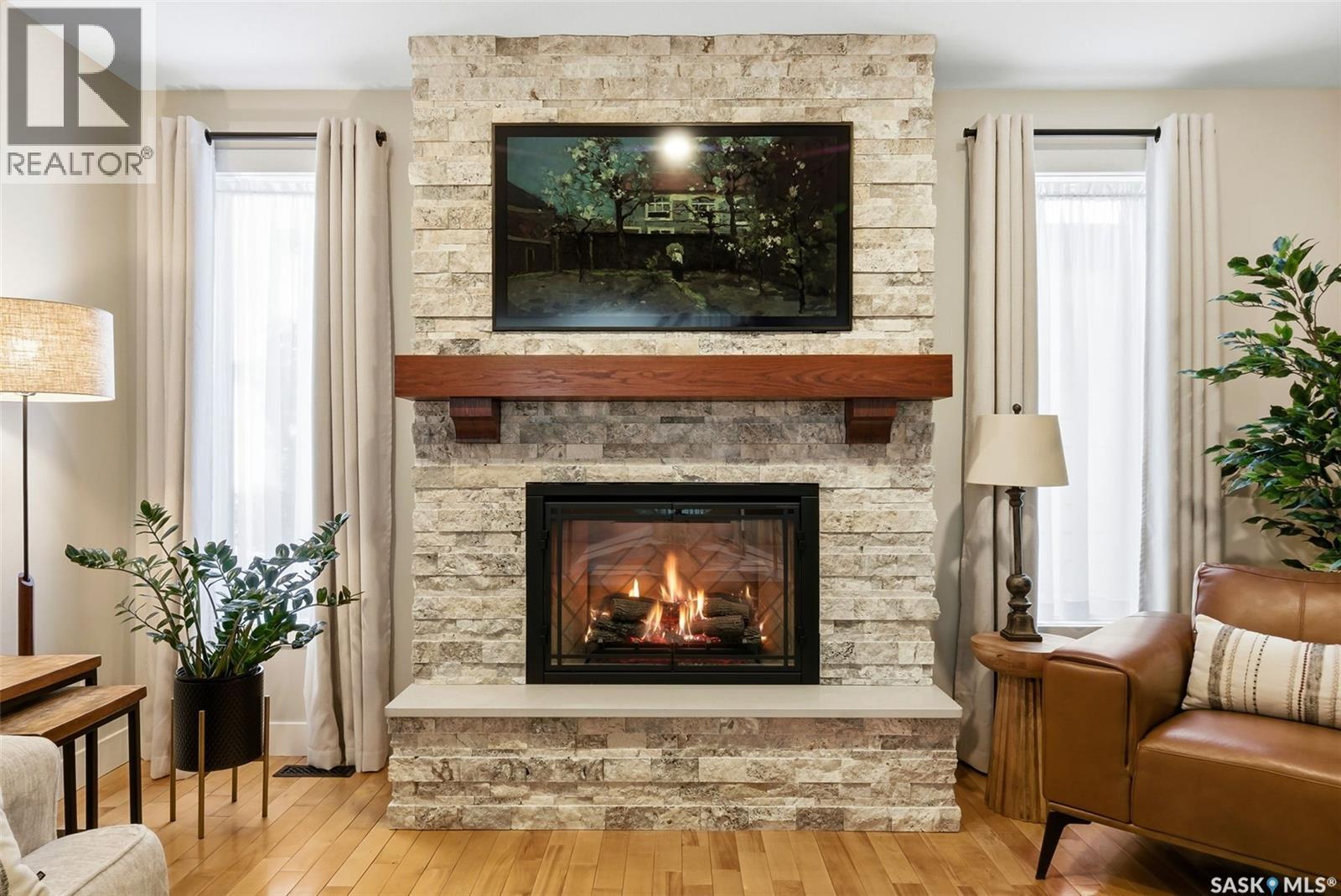 2611 Grainger Place E, Regina, SK - Indoor Photo Showing Living Room With Fireplace