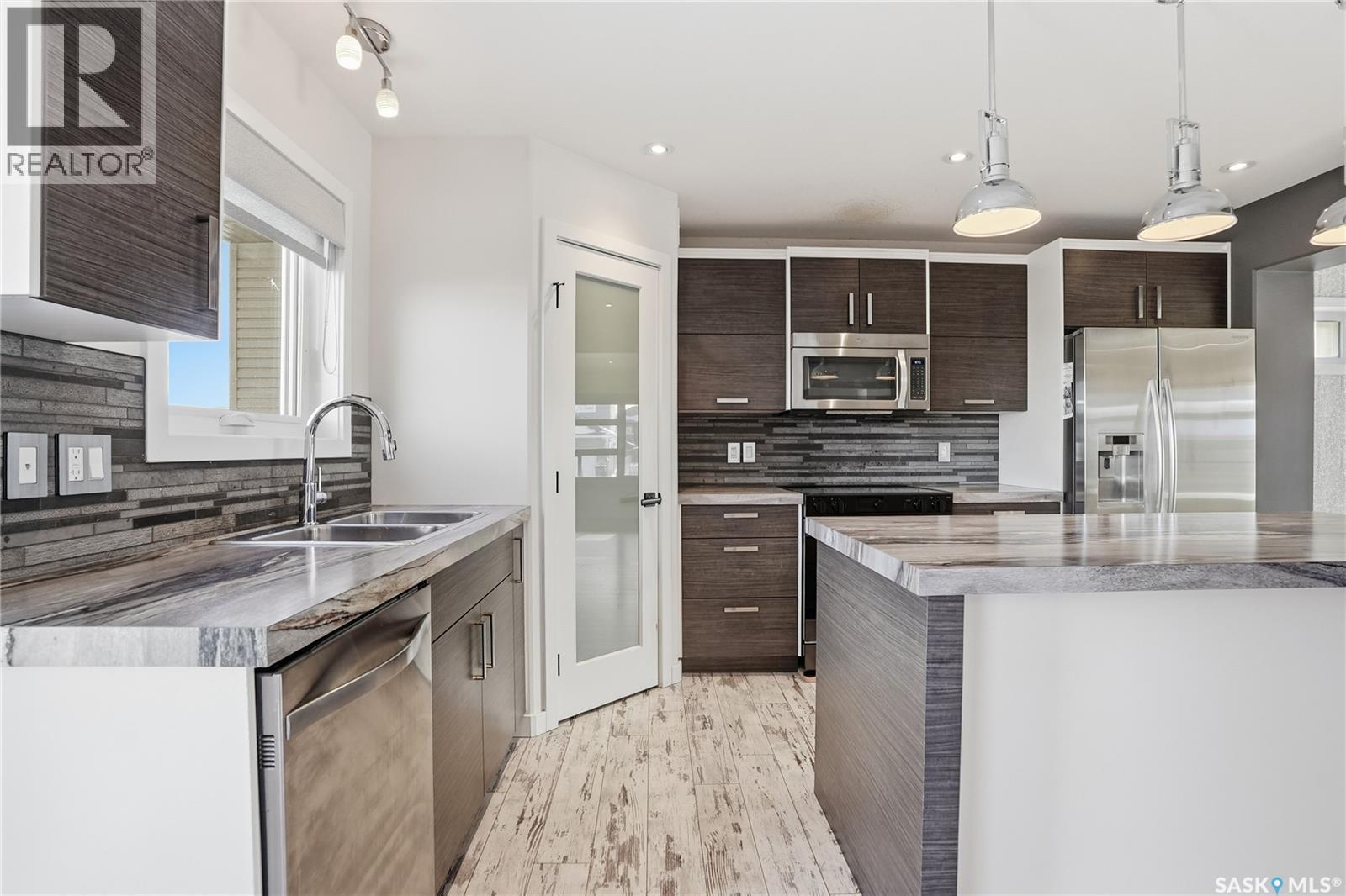 230 Kloppenburg Way, Saskatoon, SK - Indoor Photo Showing Kitchen With Stainless Steel Kitchen With Double Sink With Upgraded Kitchen