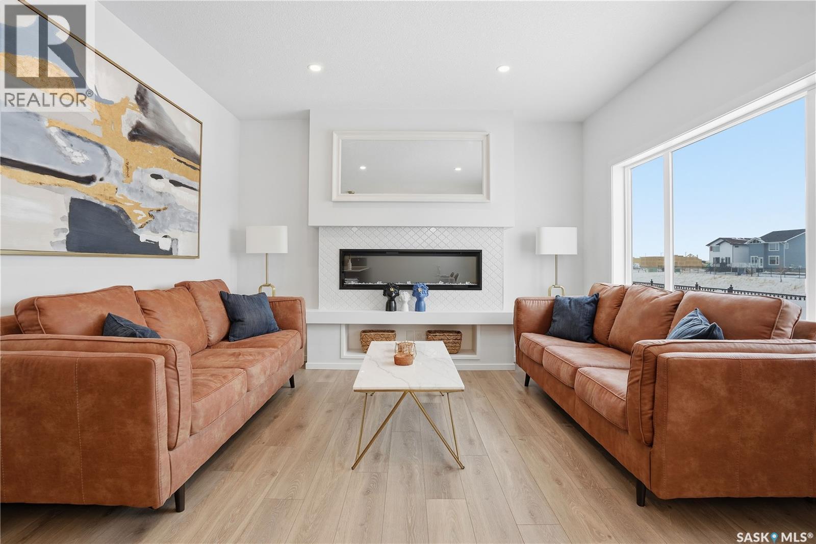 3033 Bellegarde Crescent, Regina, SK - Indoor Photo Showing Living Room With Fireplace