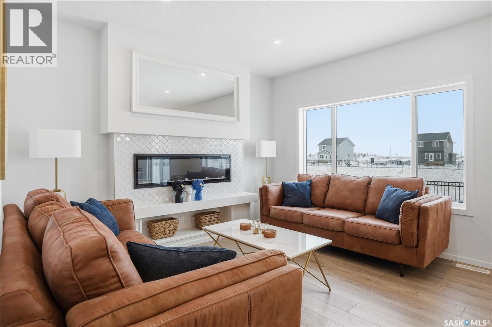 3033 Bellegarde Crescent, Regina, SK - Indoor Photo Showing Living Room With Fireplace