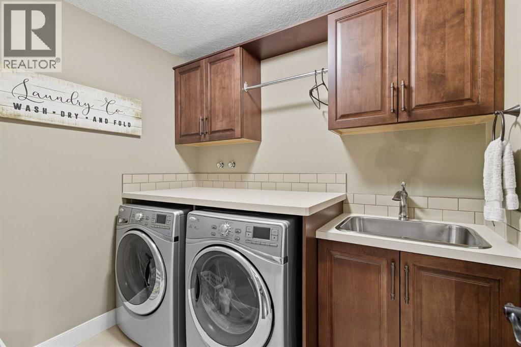 Laundry Room upper - 41 Evergreen Mount Sw, Calgary, AB - Indoor Photo Showing Laundry Room