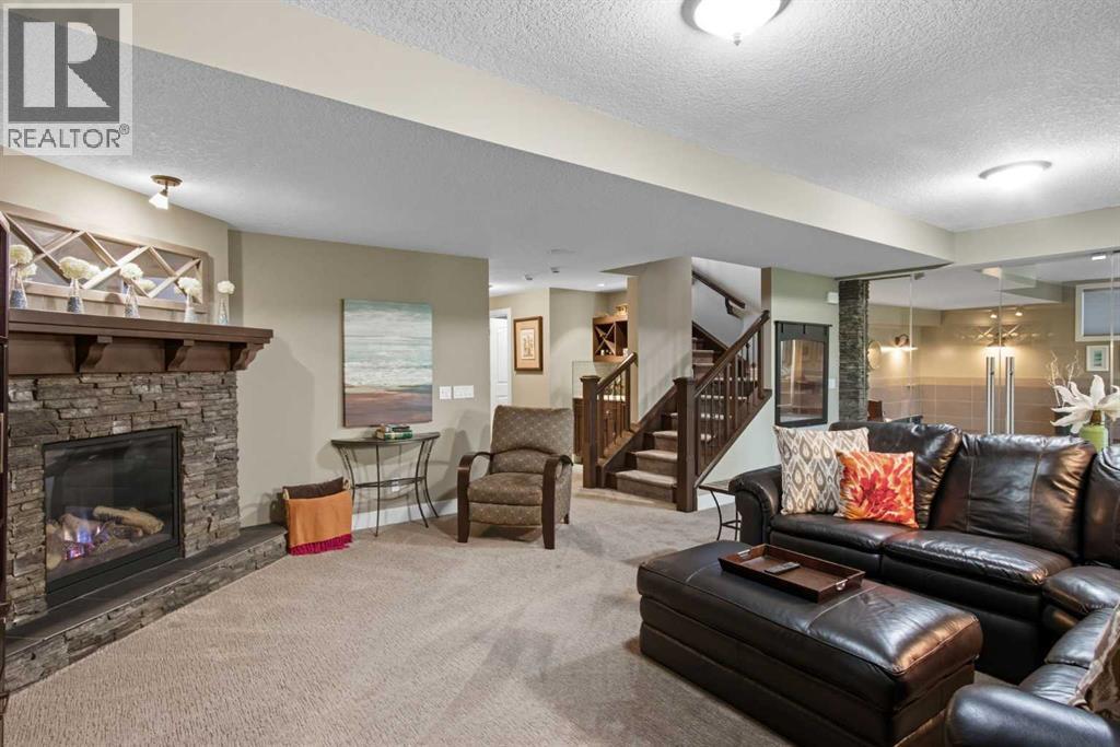 41 Evergreen Mount Sw, Calgary, AB - Indoor Photo Showing Living Room With Fireplace