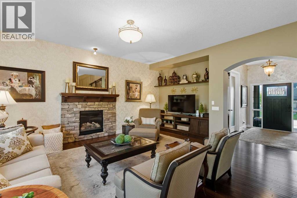 41 Evergreen Mount Sw, Calgary, AB - Indoor Photo Showing Living Room With Fireplace