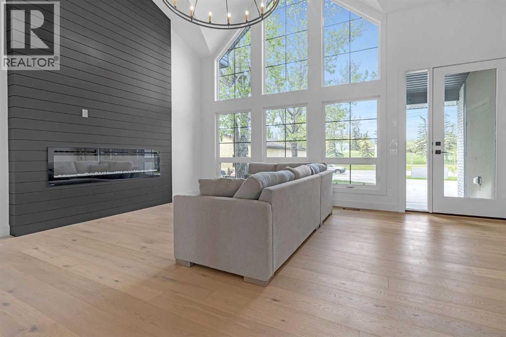 340 West Chestermere Drive, Chestermere, AB - Indoor Photo Showing Living Room With Fireplace