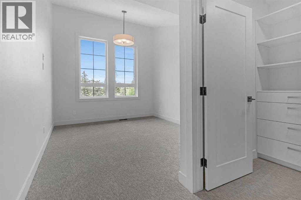 BEDROOM 2 WITH GOLF COURSE VIEWS & VAULTED CEILINGS - 340 West Chestermere Drive, Chestermere, AB - Indoor Photo Showing Other Room