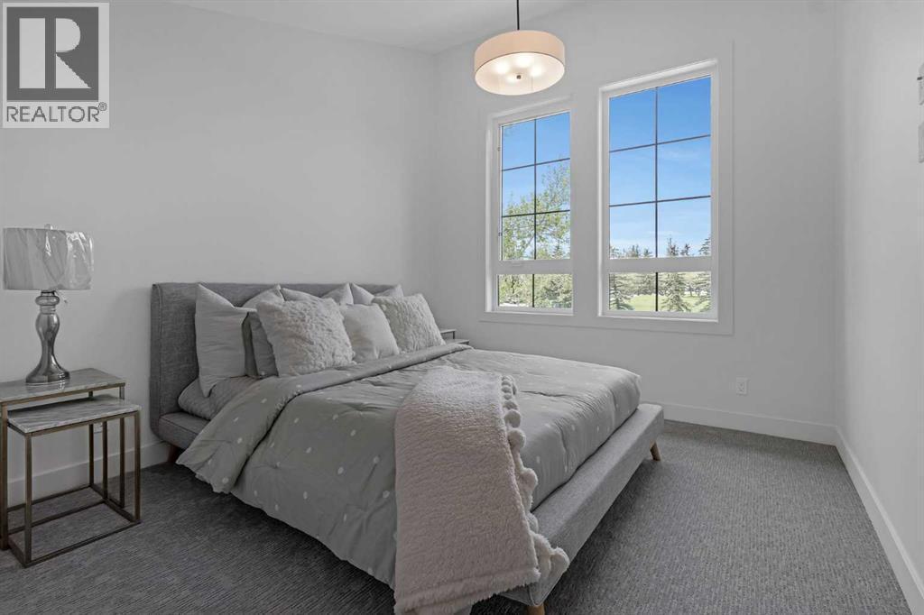 BEDROOM 3 WITH GOLF COURSE VIEWS & VAULTED CEILINGS - 340 West Chestermere Drive, Chestermere, AB - Indoor Photo Showing Bedroom