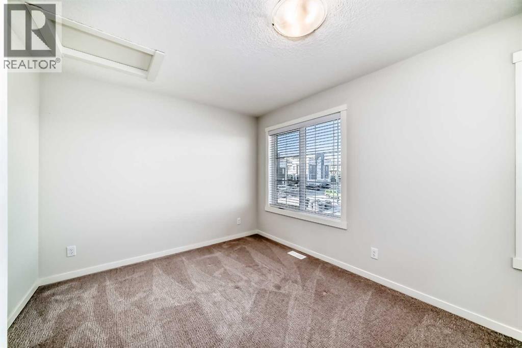 307, 474 Seton Circle Se, Calgary, AB - Indoor Photo Showing Other Room