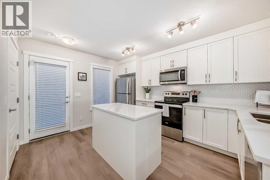 307, 474 Seton Circle Se, Calgary, AB - Indoor Photo Showing Kitchen With Stainless Steel Kitchen With Upgraded Kitchen