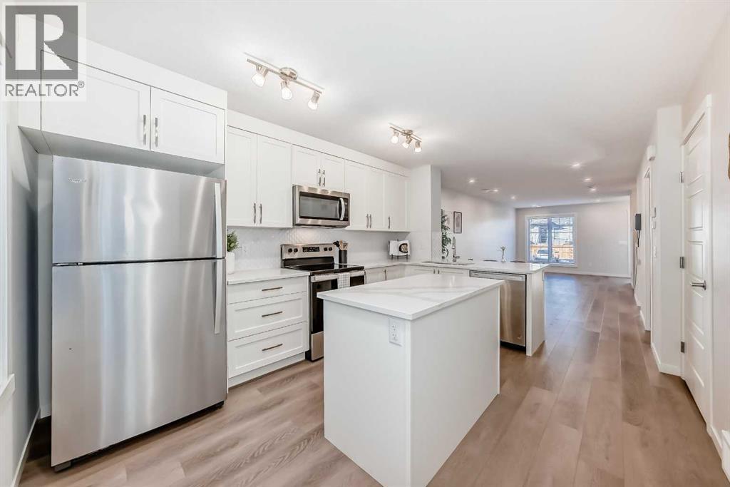 307, 474 Seton Circle Se, Calgary, AB - Indoor Photo Showing Kitchen With Stainless Steel Kitchen With Upgraded Kitchen