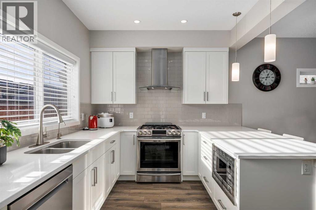 63 Masters Crescent Se, Calgary, AB - Indoor Photo Showing Kitchen With Stainless Steel Kitchen With Double Sink With Upgraded Kitchen