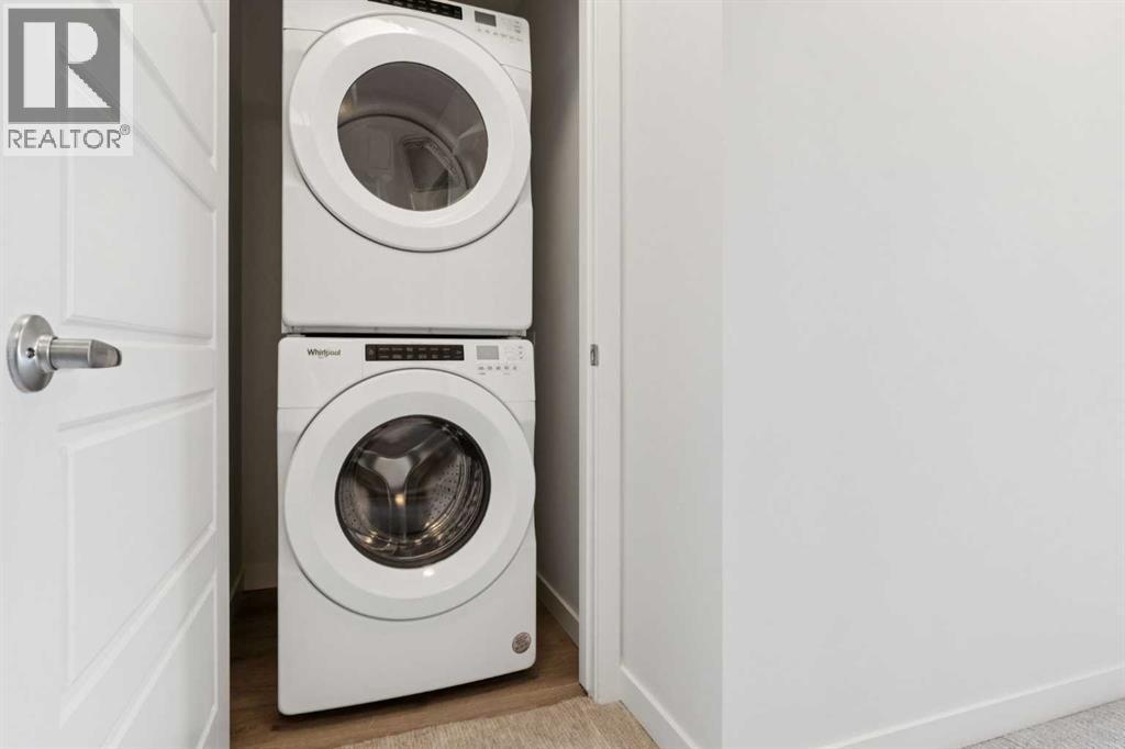 54 Evanscrest Manor Nw, Calgary, AB - Indoor Photo Showing Laundry Room